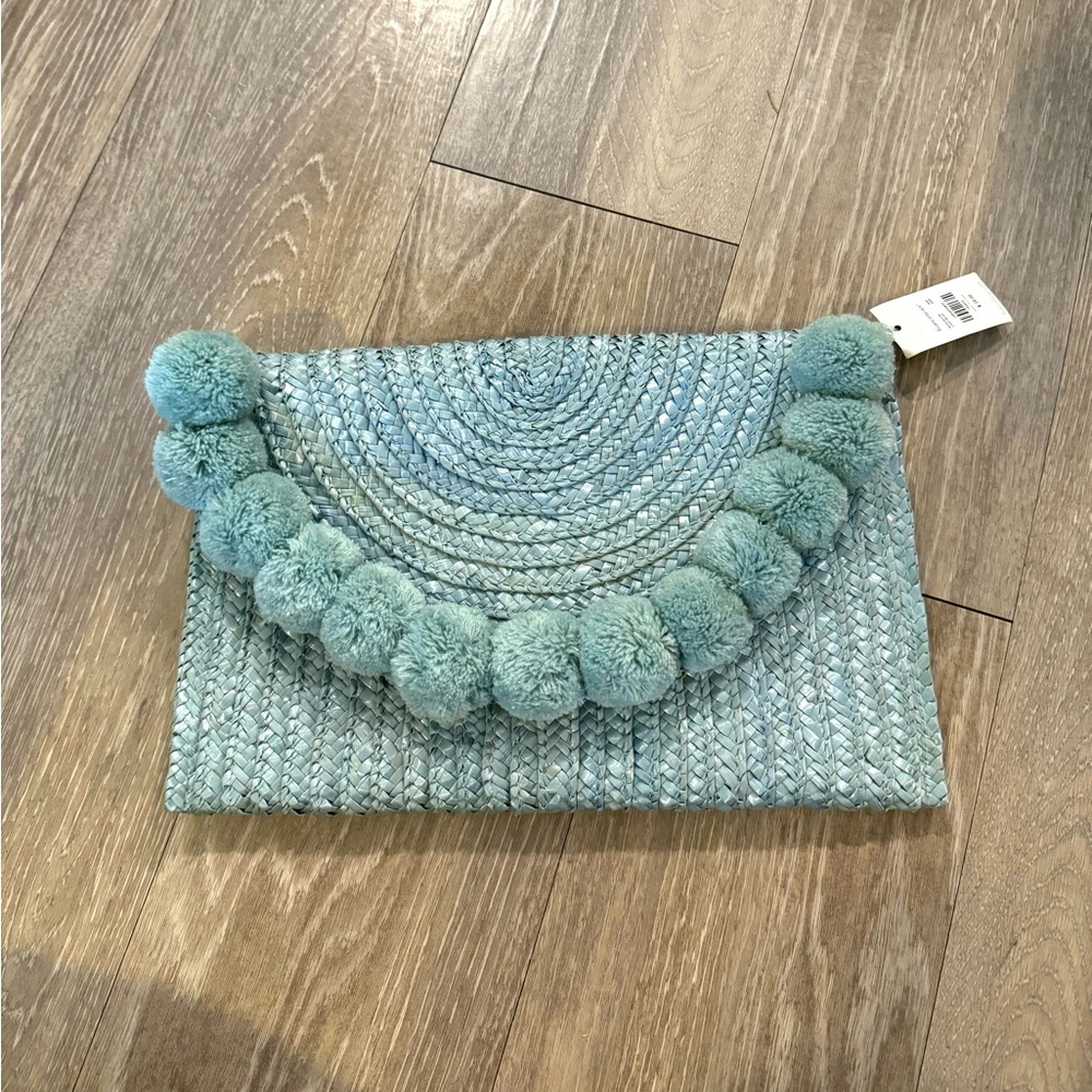 NWT Francesca’s Light Blue Pom Pom Woven Clutch